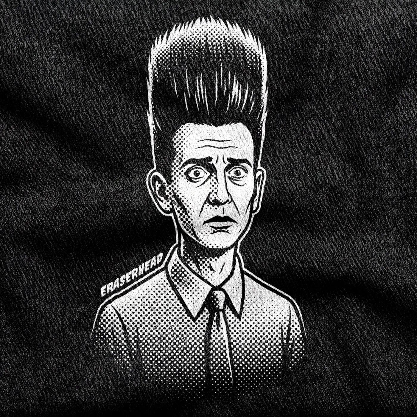 Henry Spencer from Eraserhead with the iconic tall vertical shock of hair, white on a black tee.
