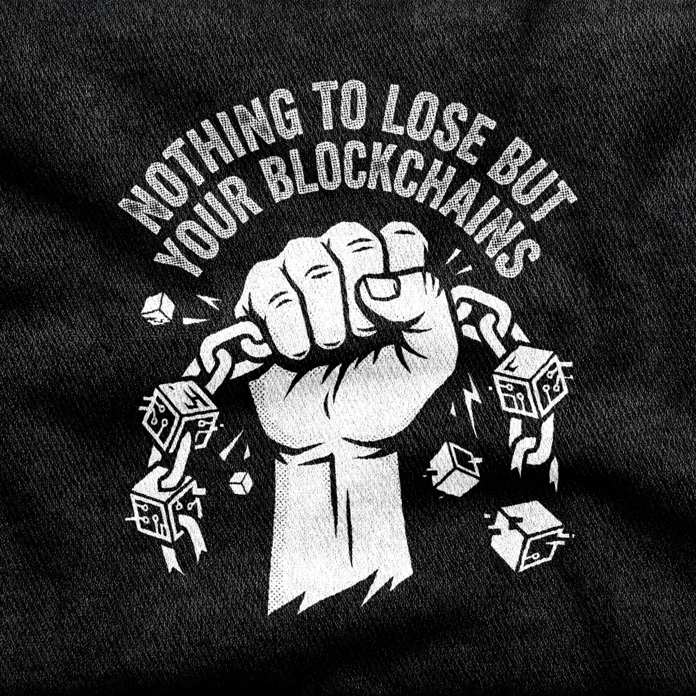 A clenched fist snapping a string of digital cubes like breaking a chain, white on a black tee.
