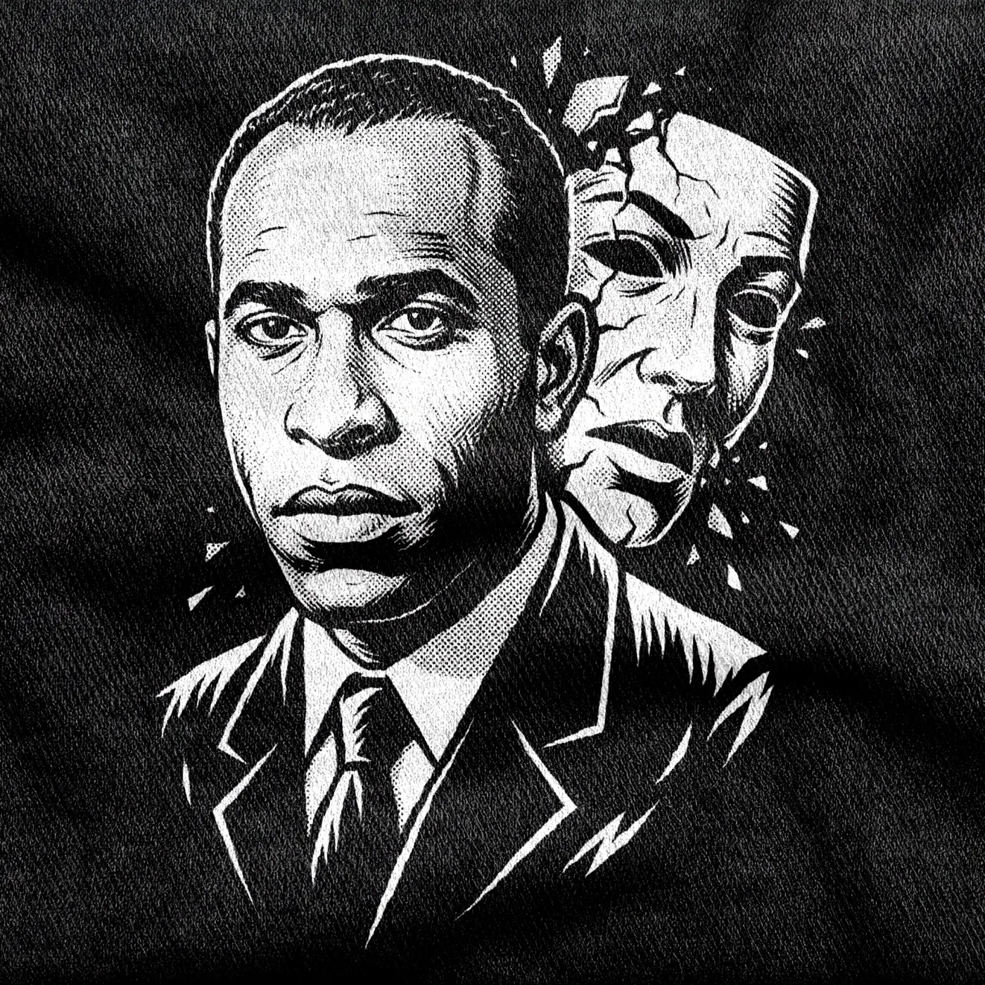 A portrait of the anti-colonial thinker Frantz Fanon, white halftone on a black tee.