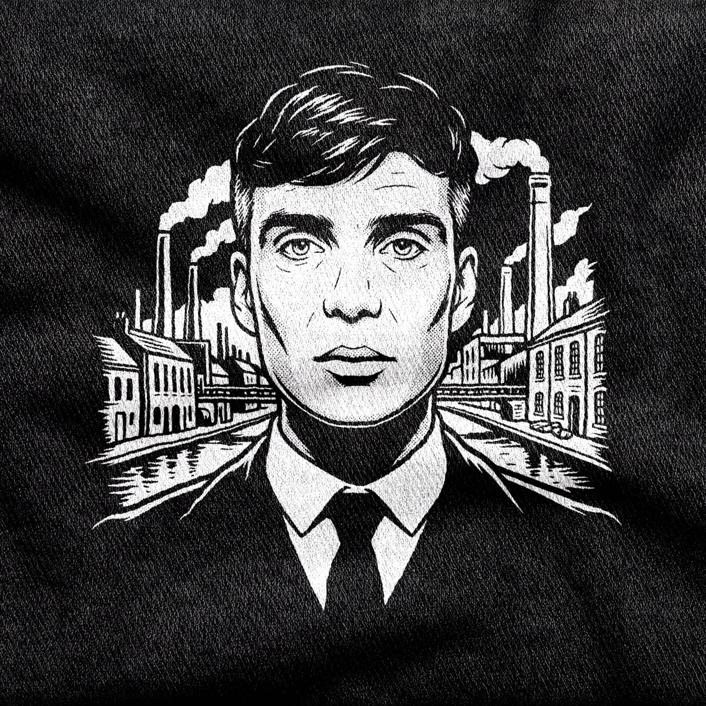 Tommy Shelby with a bare, unreadable face and sharp collar and tie, Birmingham's chimneys, canal and brick terraces smoking behind him, white on a black tee.