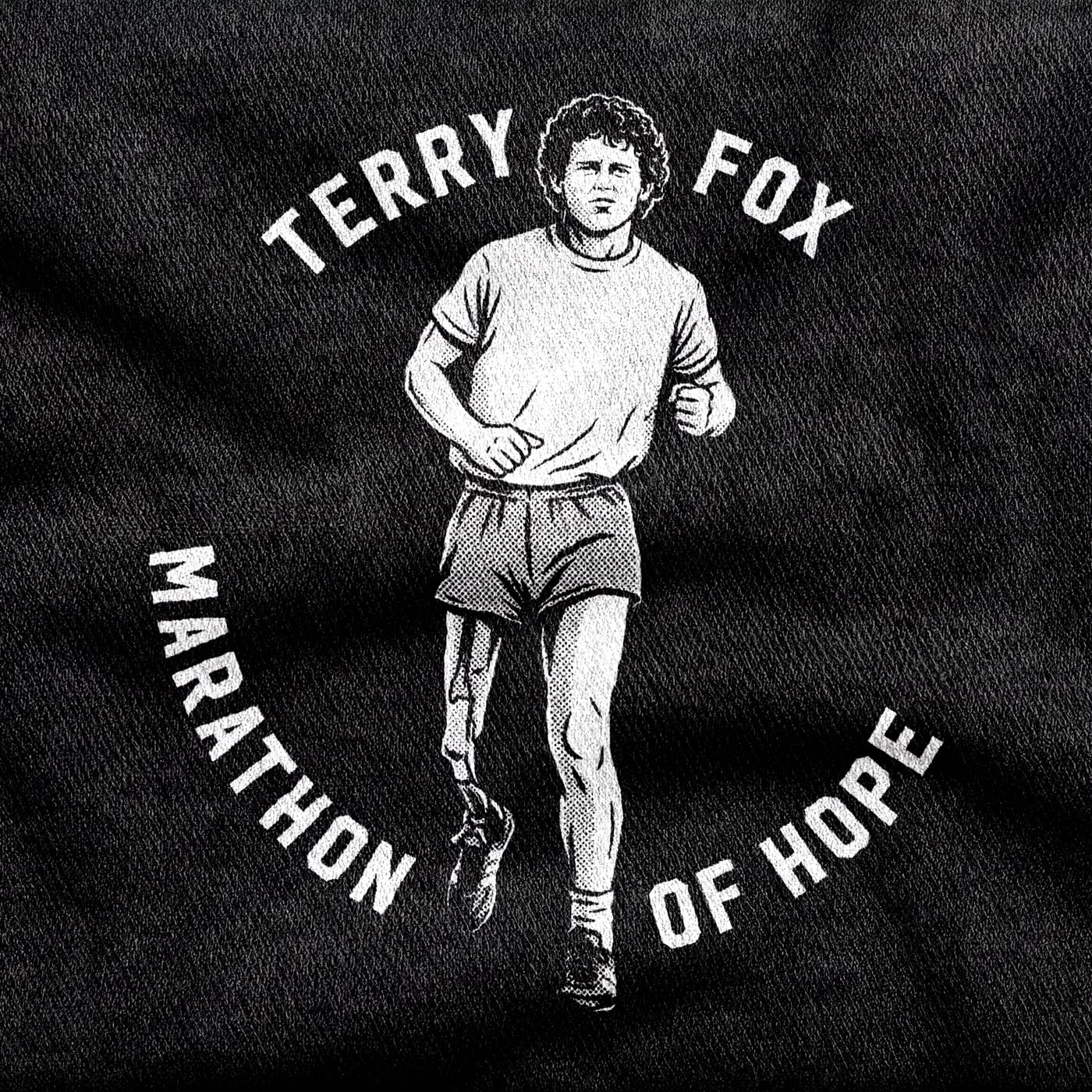 Terry Fox mid-stride on his prosthetic leg, ringed by the words "Marathon of Hope", white on a black tee.