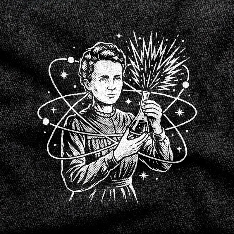 Marie Curie holding a glowing flask, ringed by atomic orbits, white halftone on a black tee.