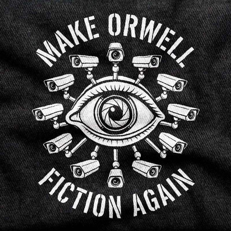 One large unblinking eye with a camera-lens iris, ringed by CCTV cameras turned to face the viewer, white on a black tee.