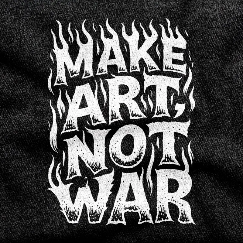 The two-word instruction "Make Art" in plain bold lettering, white on a black tee.