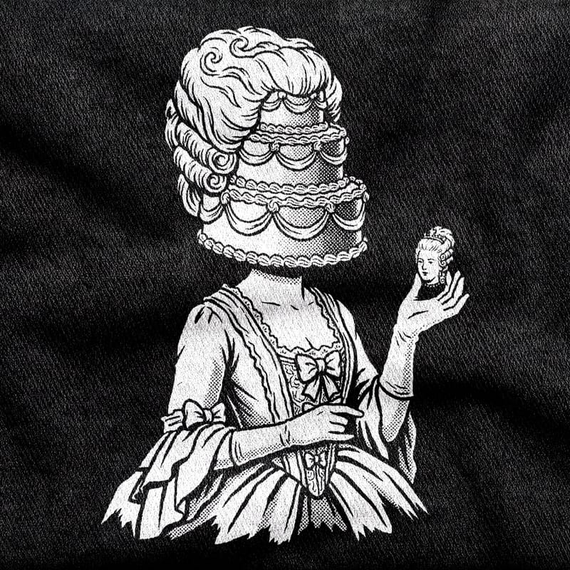 A rococo bust of Marie Antoinette crowned with a tiered cake, white on a black tee.