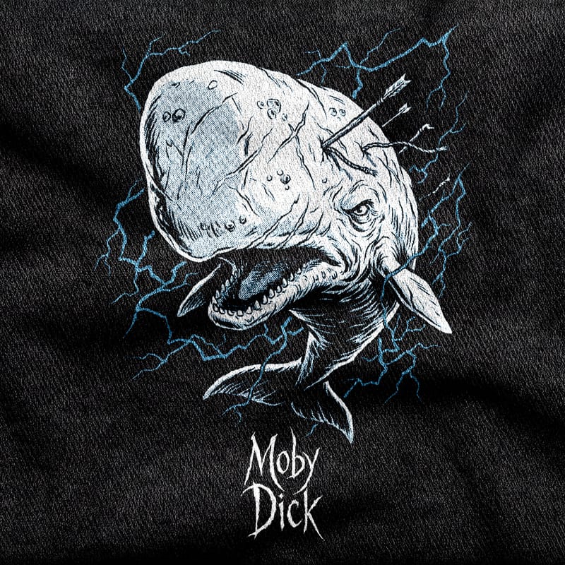 The white whale Moby Dick breaching with old harpoons buried in its head and lines trailing, against blue lightning on a black tee.